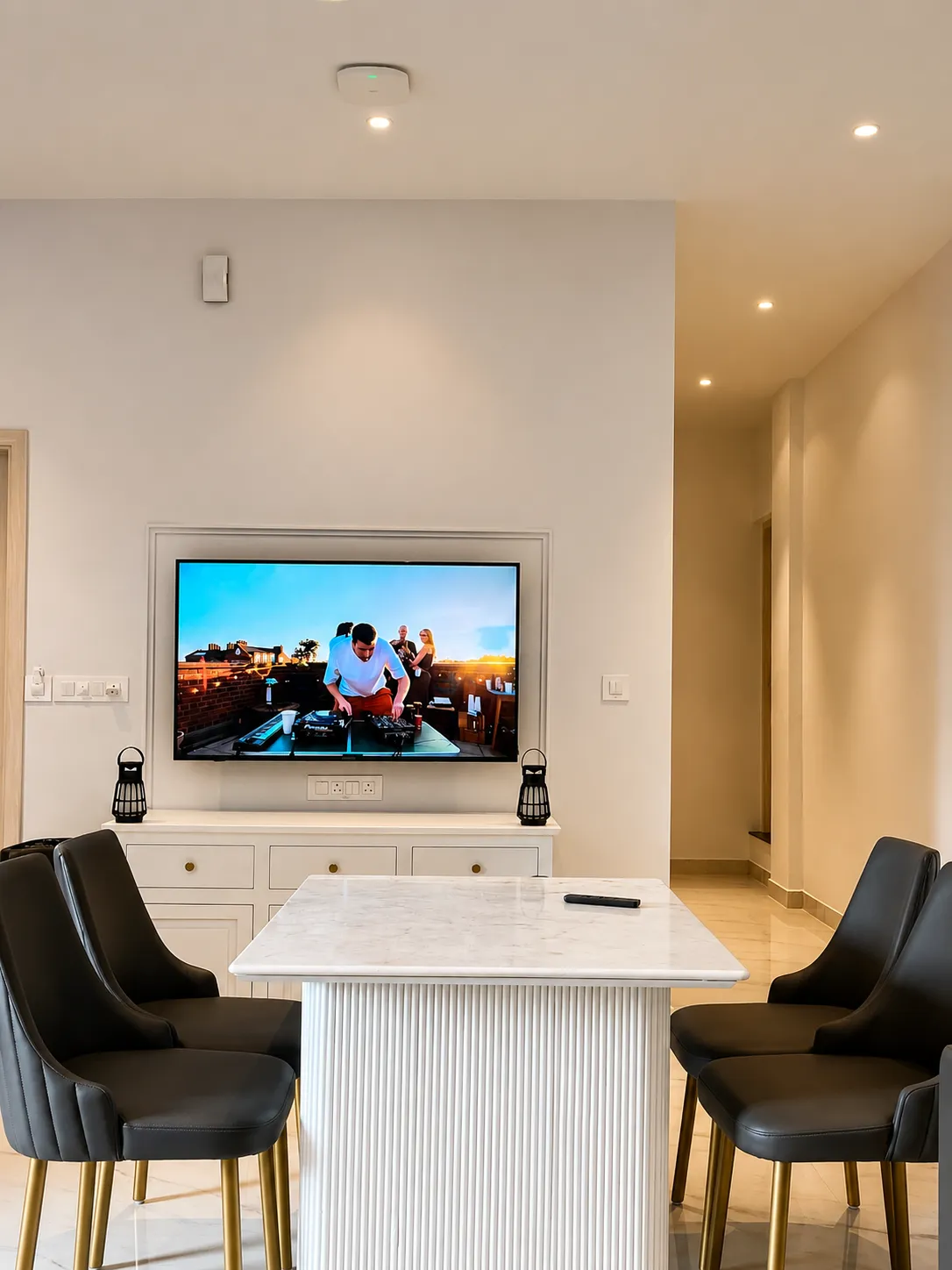 The media lounge with wall-mounted screen