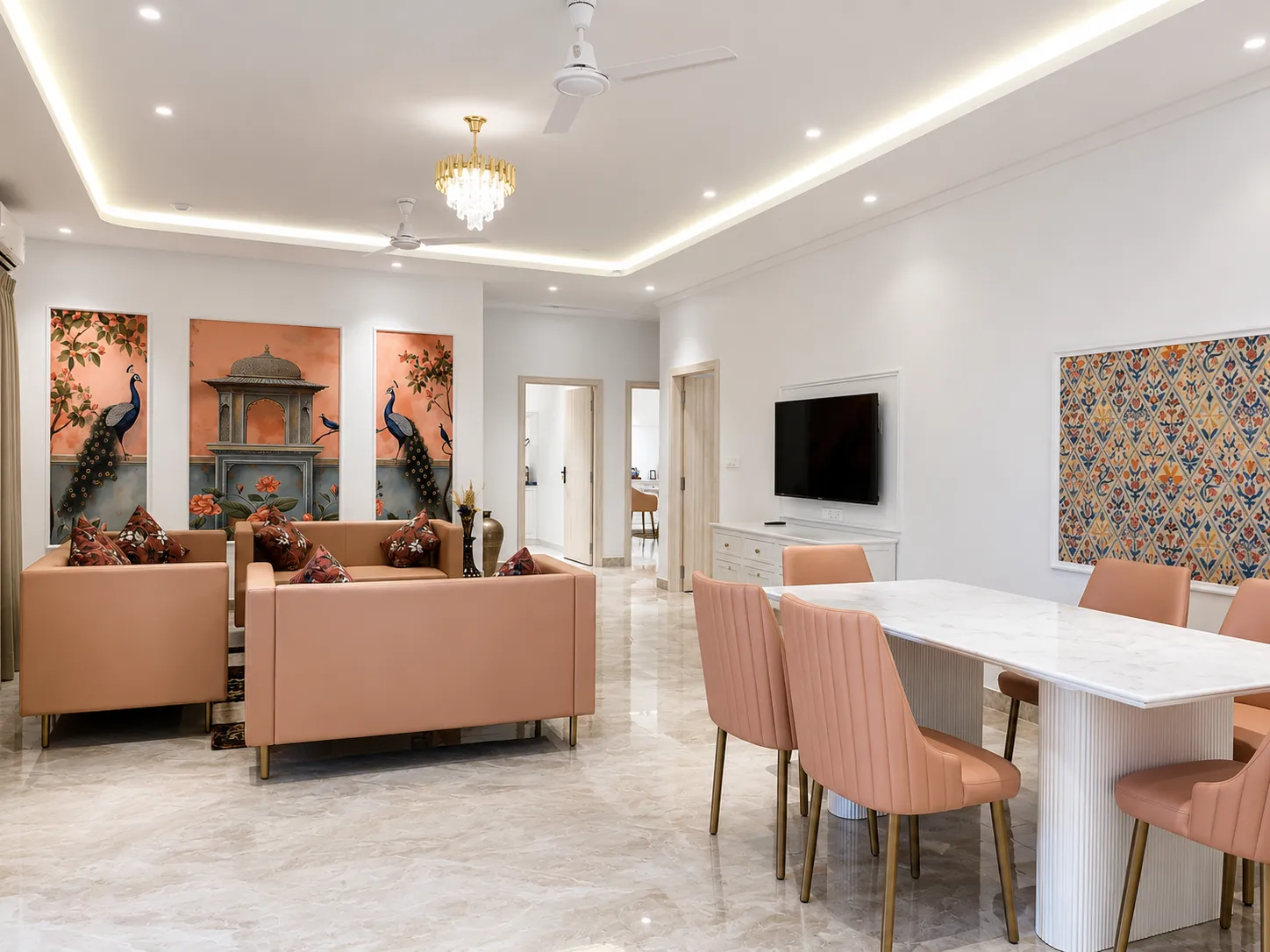 Blush-toned floor lounge with peacock wall panels and marble dining table