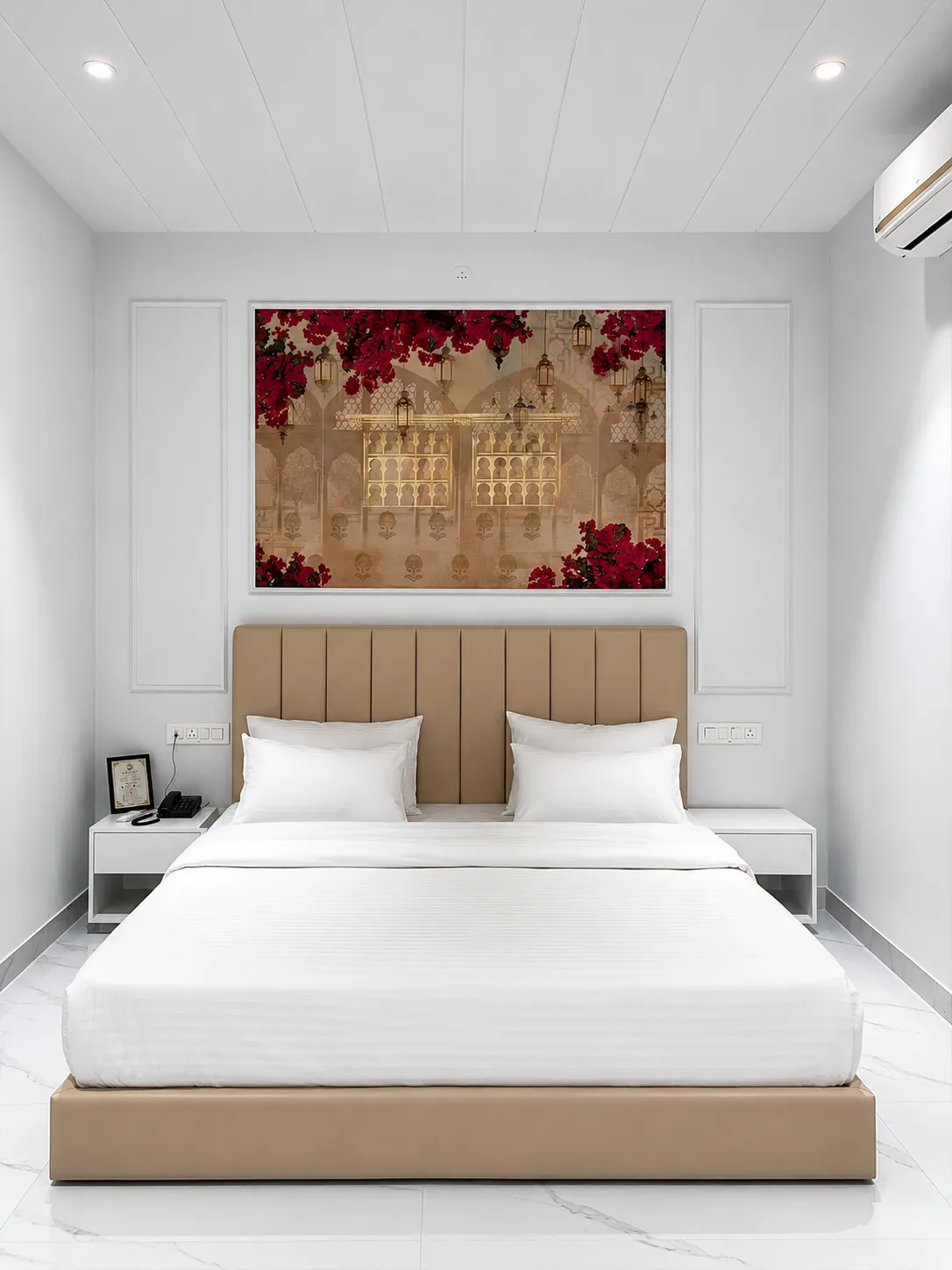 Bedroom with beige bed beneath bougainvillea-and-lantern artwork